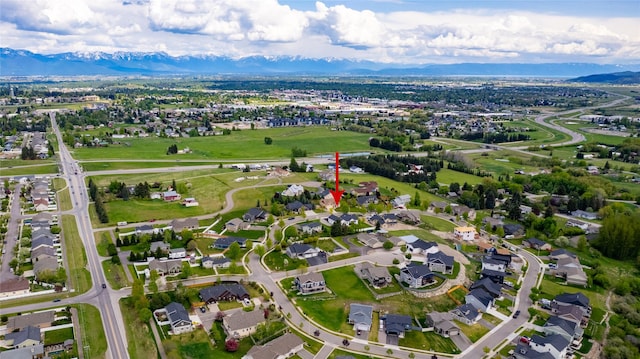 aerial overview of property's location with mountains and nearby suburban area