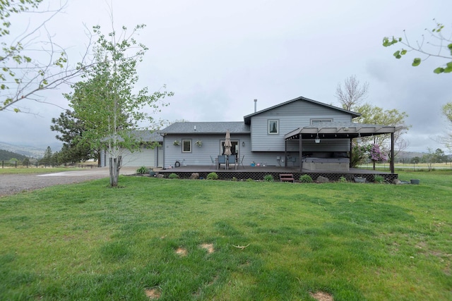 15 Lone Mountain Rd, Clancy, MT 59634 - rear view of property with a deck, an attached garage, gravel driveway, and a yard