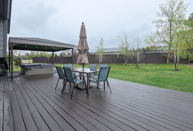 15 Lone Mountain Rd, Clancy, MT 59634 - wooden terrace featuring a hot tub and outdoor dining area