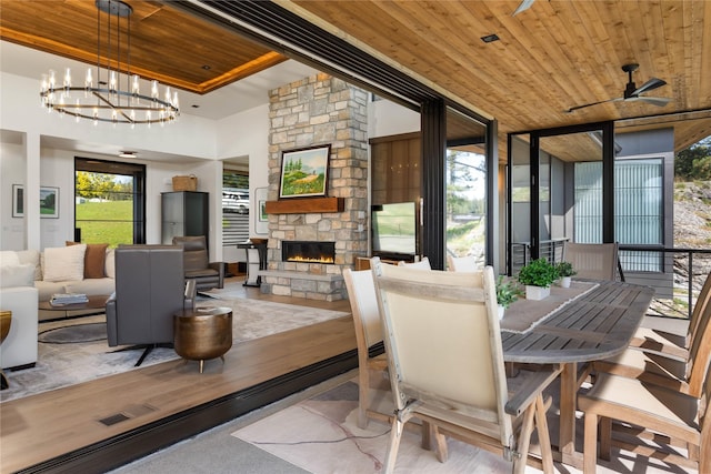 sunroom / solarium featuring a chandelier