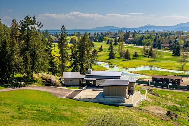 view from above of property with a water and mountain view