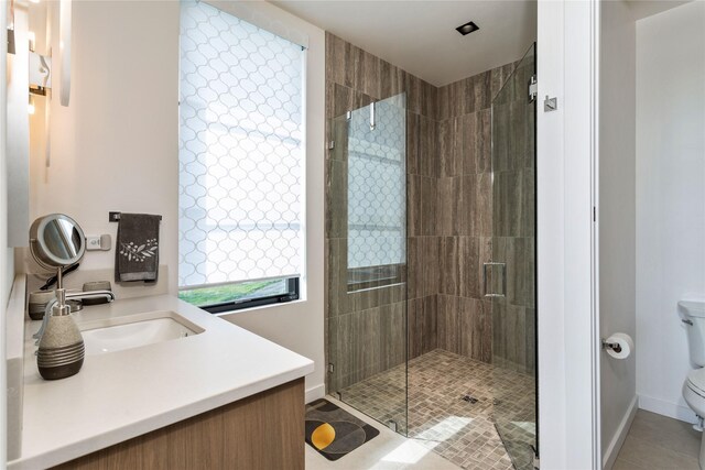 48 Eagle Rock Dr, Bigfork, MT 59911 - full bath featuring toilet, a stall shower, tile patterned flooring, and baseboards