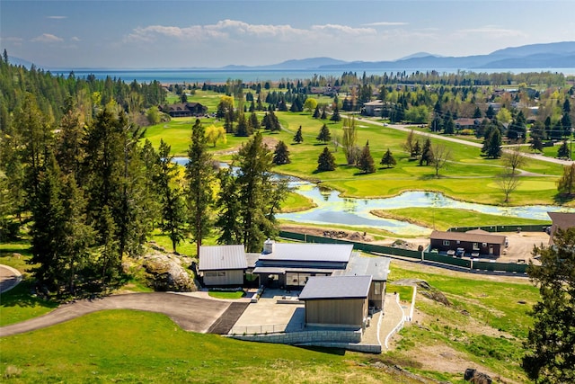 bird's eye view of a water and mountain view and a local golf course