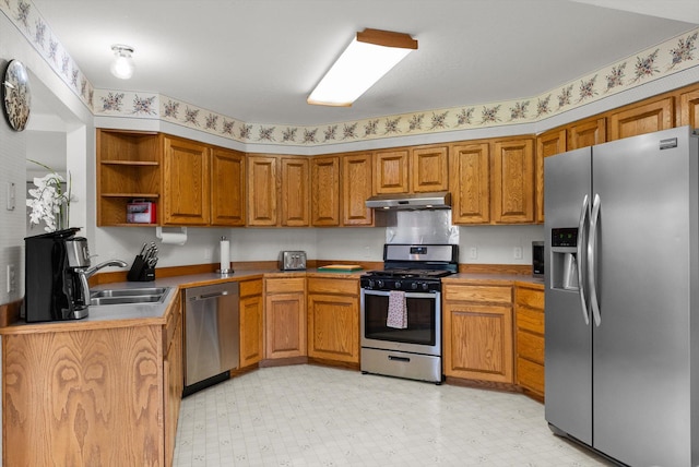 525 Tower St, Missoula, MT 59804 - kitchen featuring appliances with stainless steel finishes, under cabinet range hood, a sink, brown cabinets, and open shelves