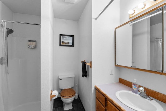 525 Tower St, Missoula, MT 59804 - bathroom with a shower with shower curtain, toilet, tile patterned flooring, and vanity