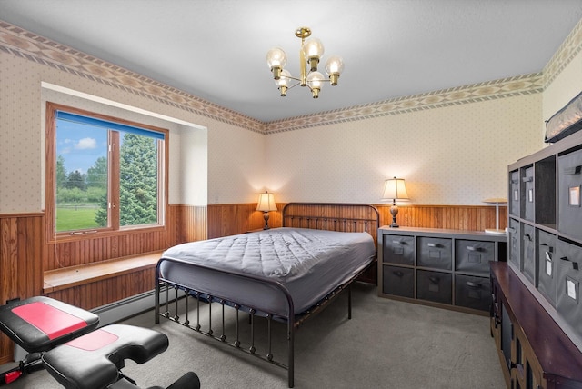 525 Tower St, Missoula, MT 59804 - carpeted bedroom with wainscoting, wood walls, a chandelier, and wallpapered walls