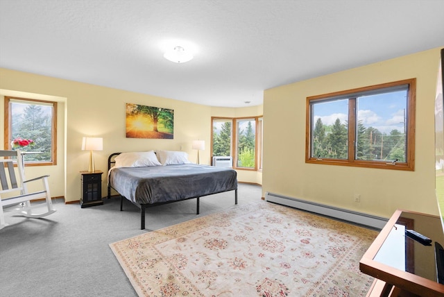 525 Tower St, Missoula, MT 59804 - carpeted bedroom with a baseboard radiator and a wall unit AC