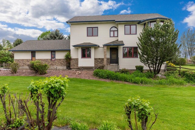 525 Tower St, Missoula, MT 59804 - view of front facade with a front yard and brick siding