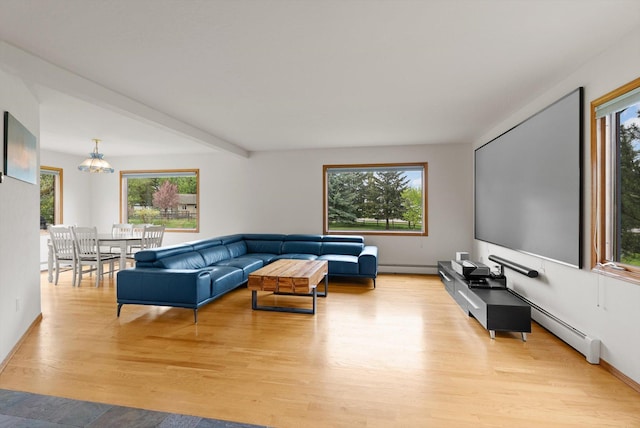 525 Tower St, Missoula, MT 59804 - living room with light wood finished floors and a baseboard heating unit