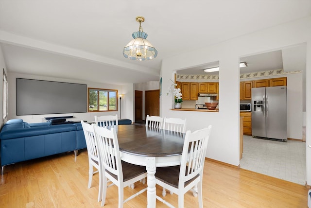 525 Tower St, Missoula, MT 59804 - dining space with a chandelier and light wood-style floors