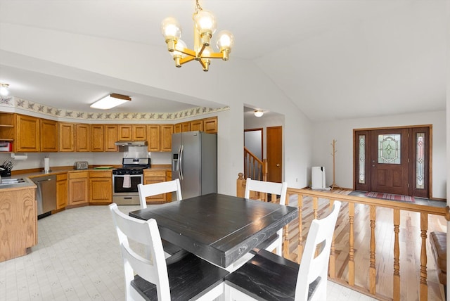 525 Tower St, Missoula, MT 59804 - dining area with a chandelier, lofted ceiling, and stairs