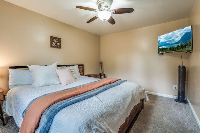 carpeted bedroom featuring baseboards and ceiling fan