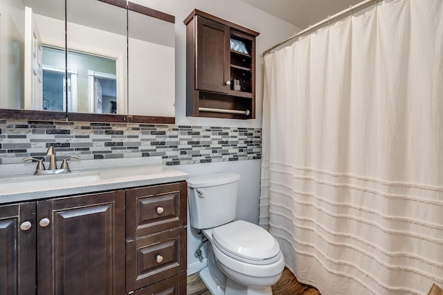 full bathroom with vanity, toilet, tasteful backsplash, and a shower with shower curtain