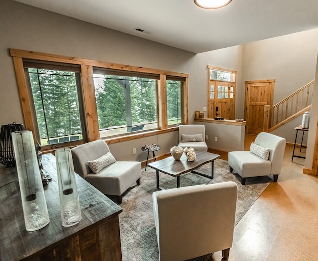 21208 Osprey Loop, Rollins, MT 59931 - living room featuring tile patterned floors and stairs
