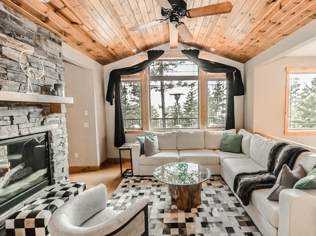 21208 Osprey Loop, Rollins, MT 59931 - living area with vaulted ceiling, ceiling fan, wooden ceiling, and a stone fireplace