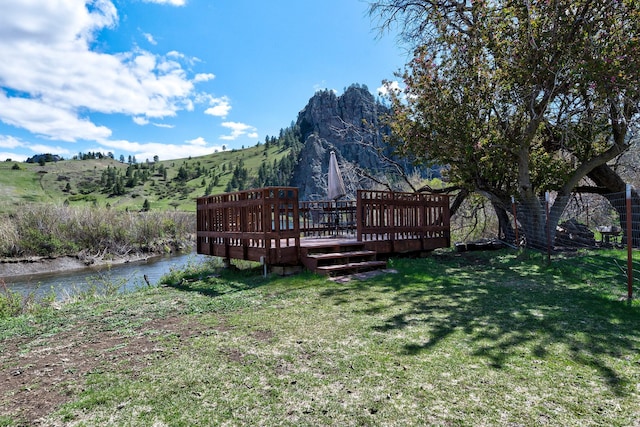 71 Seibold Ln, Cascade, MT 59421 - view of green lawn featuring a deck with mountain view