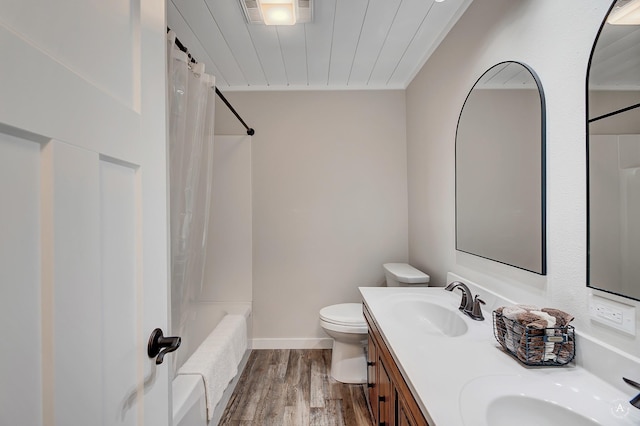71 Seibold Ln, Cascade, MT 59421 - full bath featuring wood finished floors, double vanity, toilet, shower / tub combo, and baseboards