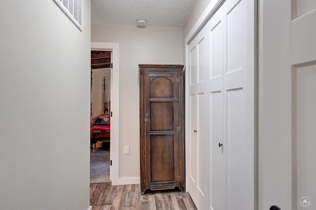 71 Seibold Ln, Cascade, MT 59421 - hallway with wood finished floors and a textured ceiling