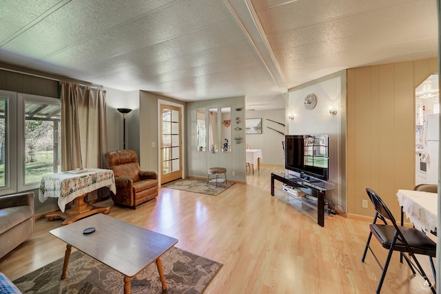 living area featuring wood finished floors and baseboards