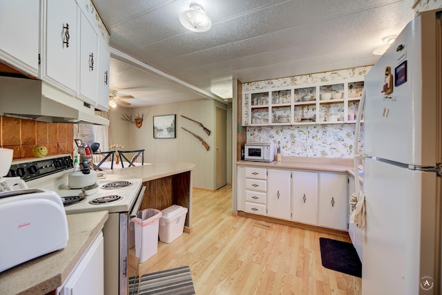 73 Seibold Ln, Cascade, MT 59421 - kitchen featuring white appliances, under cabinet range hood, light countertops, white cabinetry, and open shelves