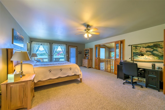 28152 White Swan Ln, Polson, MT 59860 - bedroom featuring a desk, carpet, ceiling fan, and access to exterior