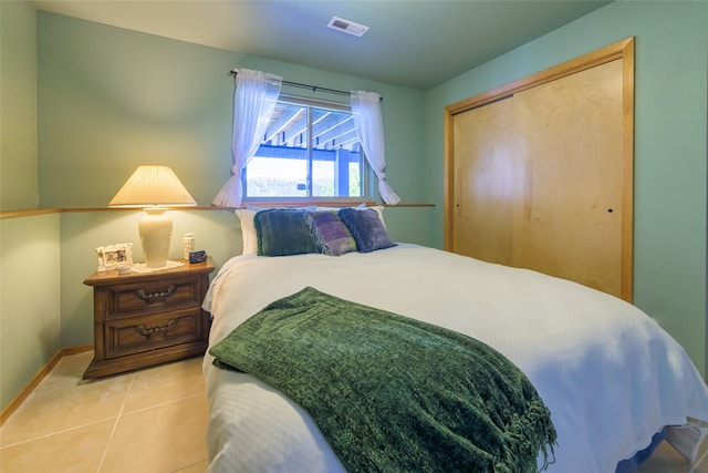 28152 White Swan Ln, Polson, MT 59860 - tiled bedroom featuring baseboards and a closet