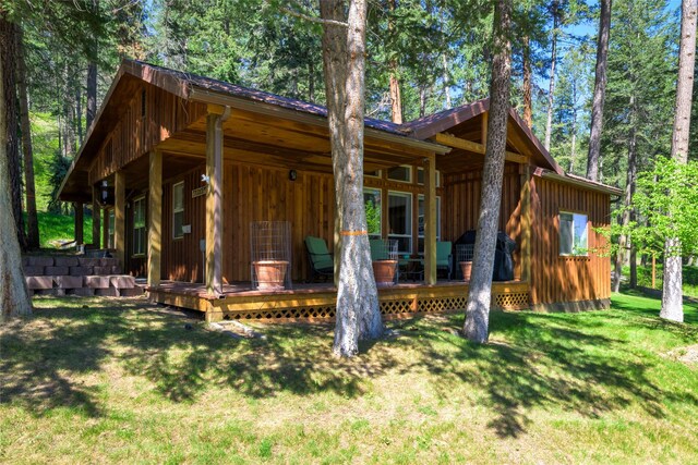 28152 White Swan Ln, Polson, MT 59860 - view of front facade featuring board and batten siding and a front yard