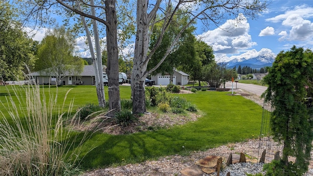 286 Edgewater Dr, Libby, MT 59923 - view of green lawn with a mountain view