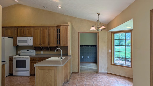 286 Edgewater Dr, Libby, MT 59923 - kitchen featuring white appliances, vaulted ceiling, a peninsula, a chandelier, and light tile patterned flooring