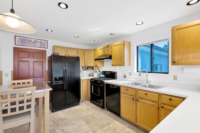 kitchen featuring black appliances, a sink, under cabinet range hood, light countertops, and recessed lighting