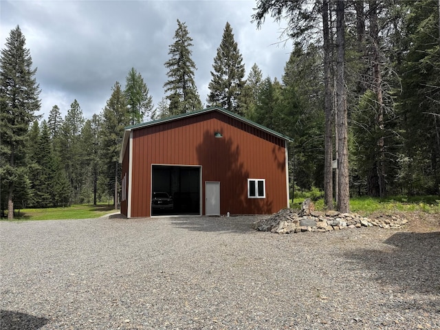 26 Castele Ln, Trout Creek, MT 59874 - view of pole building with a wooded view and gravel driveway