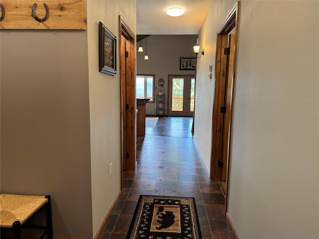 26 Castele Ln, Trout Creek, MT 59874 - hallway with dark stone finish floors and baseboards