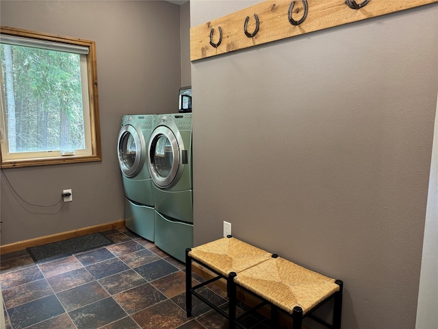 26 Castele Ln, Trout Creek, MT 59874 - laundry area with washer and dryer, baseboards, and stone tile flooring