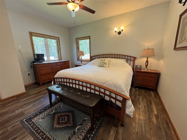 26 Castele Ln, Trout Creek, MT 59874 - bedroom featuring dark wood-type flooring, baseboards, and a ceiling fan