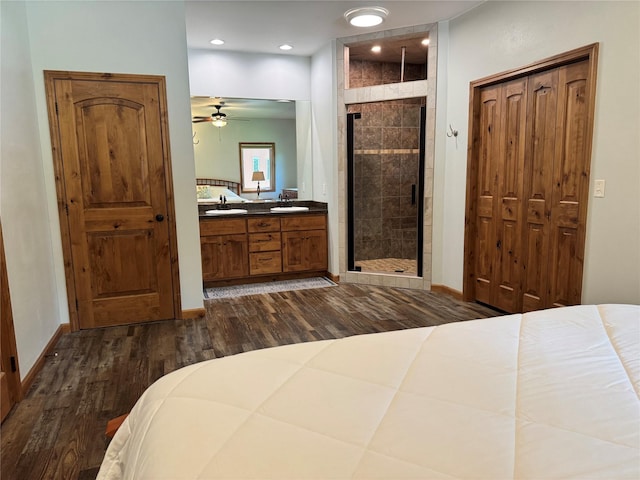 26 Castele Ln, Trout Creek, MT 59874 - bedroom featuring dark wood-style flooring, connected bathroom, baseboards, recessed lighting, and a sink