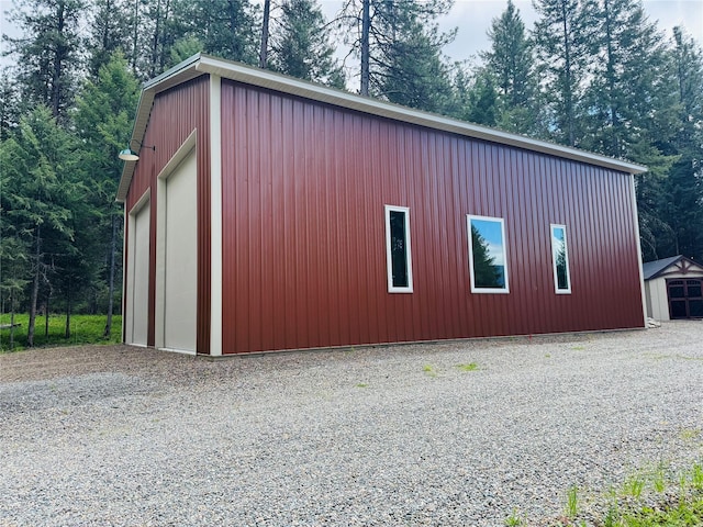 26 Castele Ln, Trout Creek, MT 59874 - view of home's exterior featuring an outbuilding and a detached garage