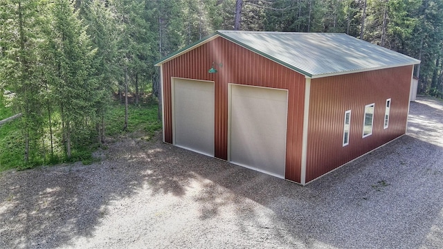 26 Castele Ln, Trout Creek, MT 59874 - detached garage featuring a forest view