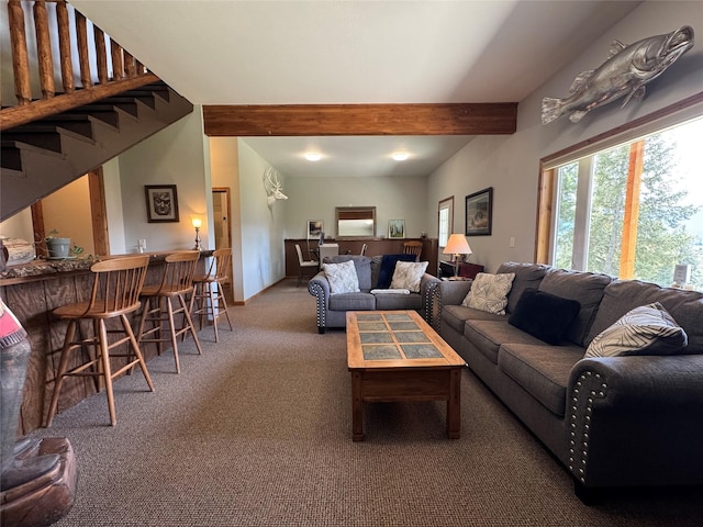 26 Castele Ln, Trout Creek, MT 59874 - living room with beam ceiling, carpet, bar, and stairway