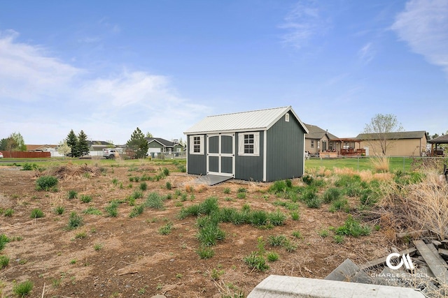 view of shed with fence