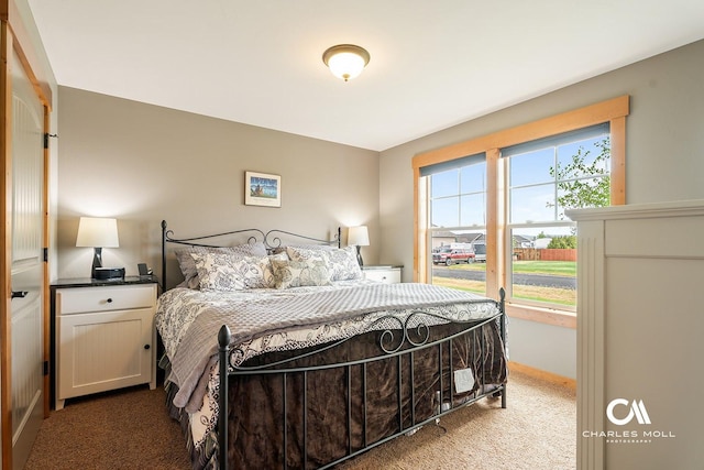 carpeted bedroom with baseboards