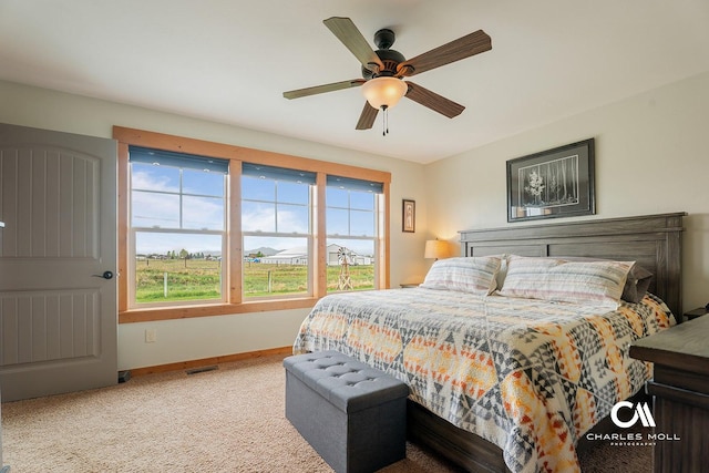 bedroom featuring baseboards, carpet, and ceiling fan