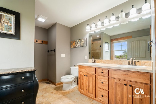 full bathroom featuring toilet, baseboards, double vanity, and a shower
