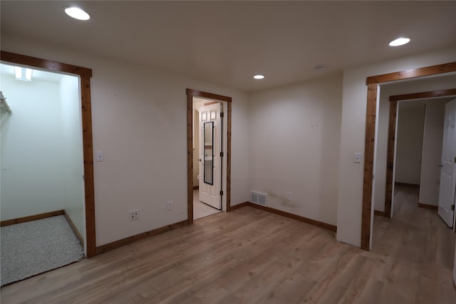 1515 11th St W, Columbia Falls, MT 59912 - unfurnished bedroom with recessed lighting, baseboards, and light wood-style floors