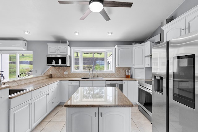 2965 Terrace Dr, Missoula, MT 59803 - kitchen with appliances with stainless steel finishes, a sink, an AC wall unit, healthy amount of natural light, and recessed lighting