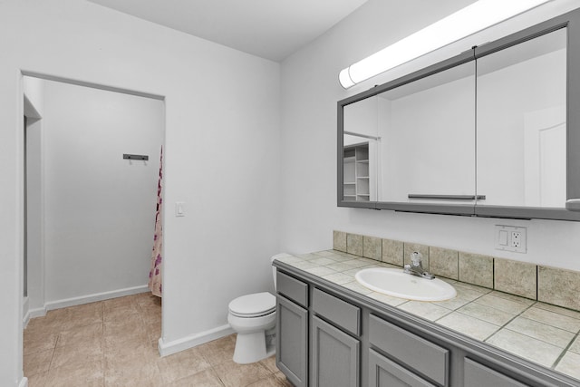 2965 Terrace Dr, Missoula, MT 59803 - full bath featuring toilet, vanity, and baseboards