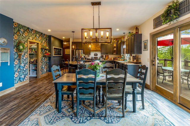 25 Hodge Rdg, Kila, MT 59920 - dining space featuring baseboards, wallpapered walls, light wood finished floors, a chandelier, and recessed lighting
