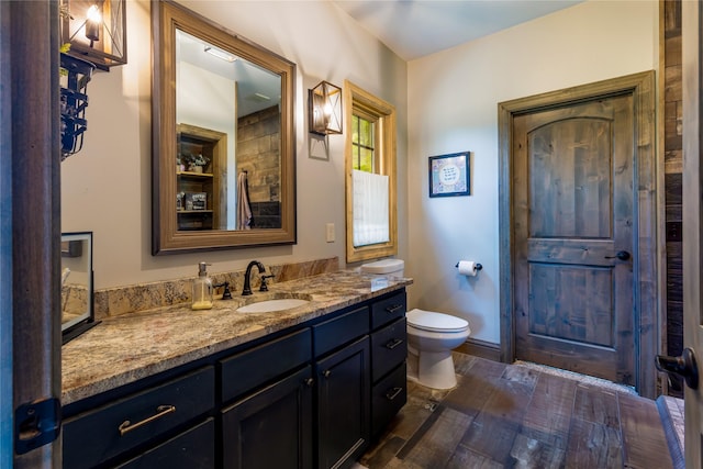25 Hodge Rdg, Kila, MT 59920 - bathroom with toilet, vanity, and wood finished floors