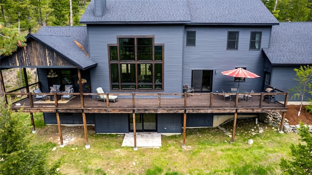 25 Hodge Rdg, Kila, MT 59920 - rear view of house with a shingled roof and a deck