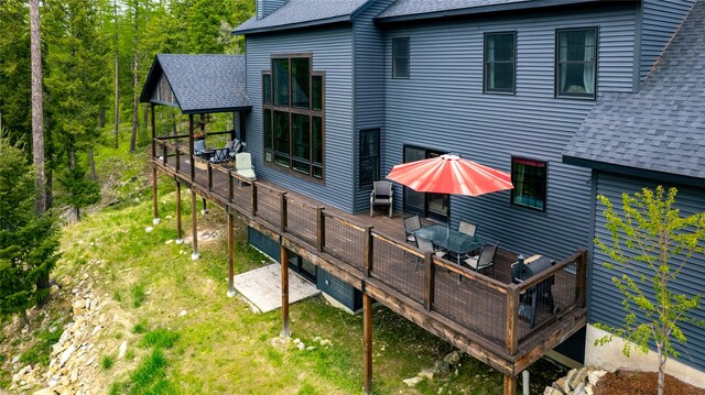25 Hodge Rdg, Kila, MT 59920 - rear view of property featuring a shingled roof and a deck
