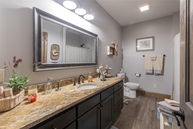 25 Hodge Rdg, Kila, MT 59920 - bathroom featuring toilet, wood finished floors, vanity, and baseboards